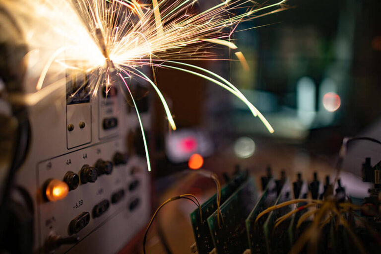 Electrostatic Hazards shown as sparks from discharge in industrial equipment