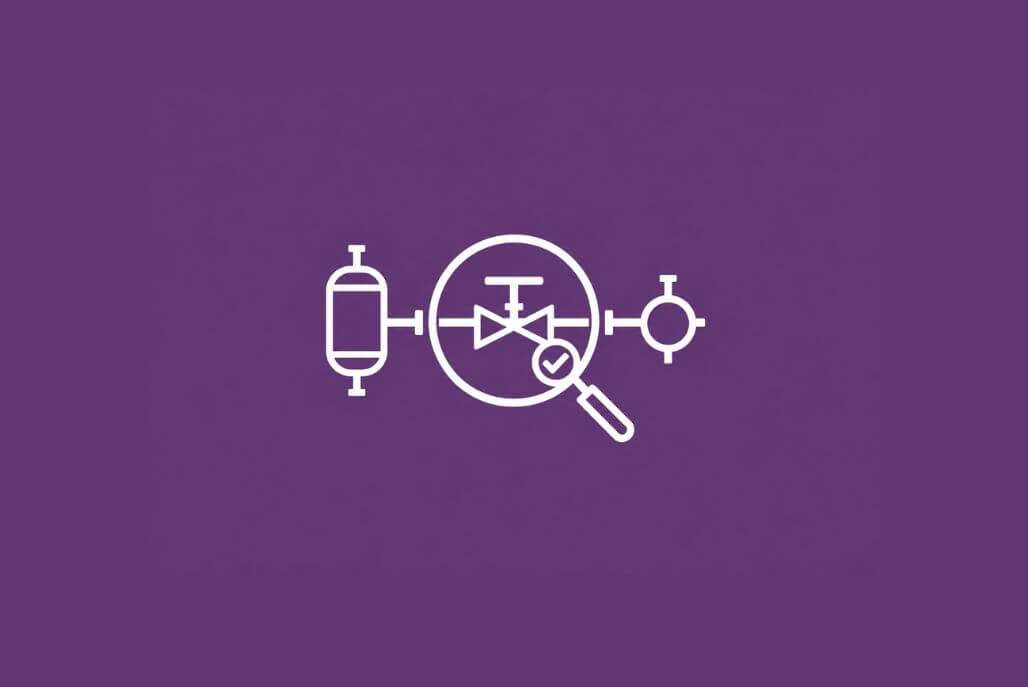 Magnifying glass over an industrial valve and connected equipment, representing a process safety consultant’s review.