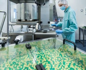 Pharmaceutical process safety professional ensuring safety and compliance in a pharmaceutical lab.
