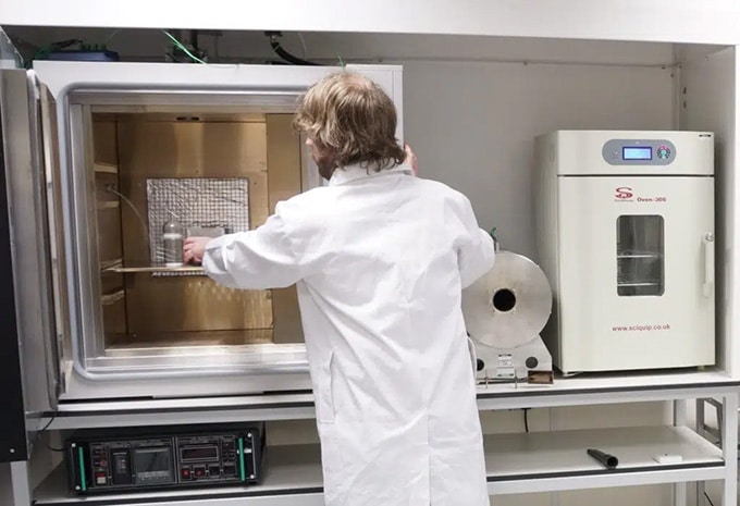 Technician conducting process safety testing in a laboratory setting at Sigma-HSE