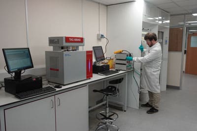 Scientist conducting chemical reaction hazards testing in a laboratory, ensuring process safety.
